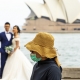 Coronavirus spreads to Sydney - masked person interrupts wedding photo